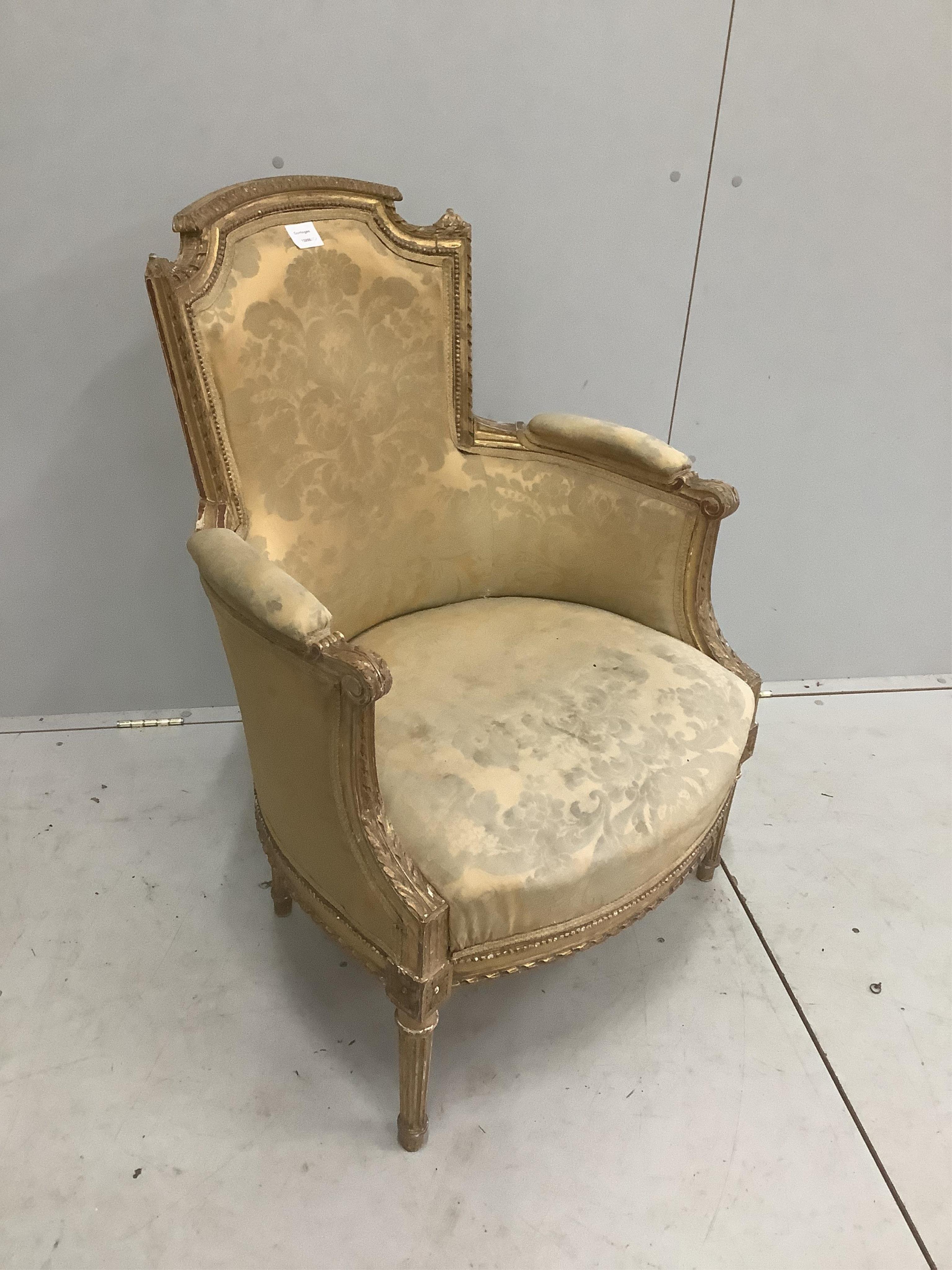 A Louis XV style carved giltwood and composition fauteuil, width 66cm, depth 52cm, height 90cm. Condition - fair